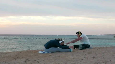 Free Video Stock Stretching Before Going For A Run On The Beach Live Wallpaper - Free Live Wallpaper