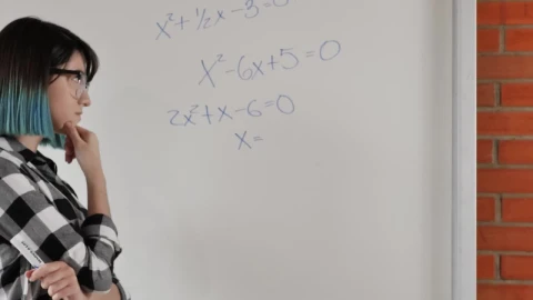 Free Video Stock Student Girl Trying To Solve Equations On The Whiteboard Live Wallpaper - Free Live Wallpaper