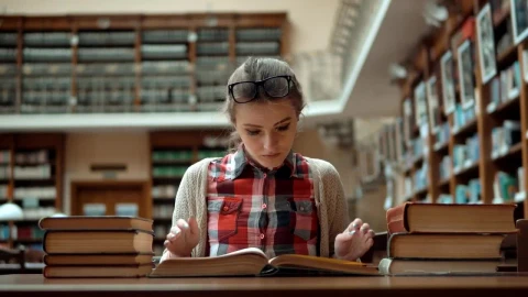 Free Video Stock Student Stressed Over Exam Sits With Books In Library Live Wallpaper - Free Live Wallpaper