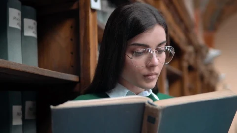 Free Video Stock Student Surprised By Something She Reads In Book Live Wallpaper - Free Live Wallpaper