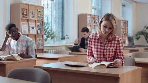 Free Video Stock Student With Book And Tablet In The Library Live Wallpaper - Free Live Wallpaper