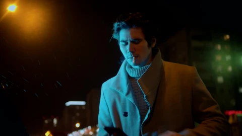Free Video Stock Stylish Man Smoking A Cigarette And Texting A Message Live Wallpaper - Free Live Wallpaper