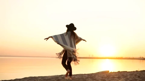 Free Video Stock Stylish Millennial Woman Spins On Beach At Sunset Live Wallpaper - Free Live Wallpaper
