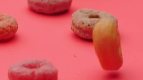 Free Video Stock Sugar Ring Cereal Gliding Across A Pink Surface Live Wallpaper - Free Live Wallpaper