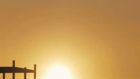 Free Video Stock Sun Hiding Between Hills On The Horizon Live Wallpaper - Free Live Wallpaper