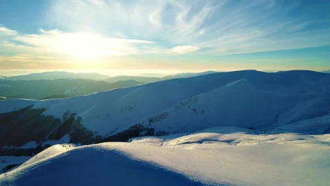 Free Video Stock Sun Illuminating The Snowy Relief Of The Mountains Live Wallpaper - Free Live Wallpaper