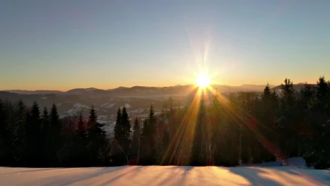 Free Video Stock sunrise sun flare in the snowy mountains Live Wallpaper - Free Live Wallpaper