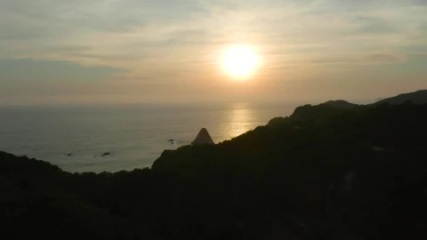 Free Video Stock sunset at sea seen from the top of a coast Live Wallpaper - Free Live Wallpaper