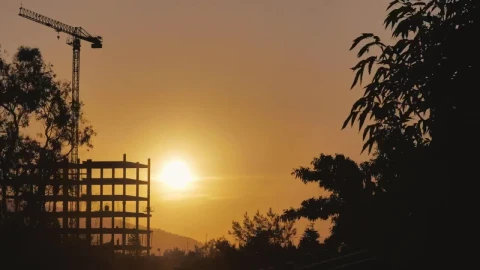 Free Video Stock sunset behind a building under construction Live Wallpaper - Free Live Wallpaper