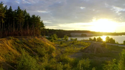 Free Video Stock sunset on a river next to a valley Live Wallpaper - Free Live Wallpaper