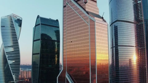 Free Video Stock sunset reflecting on skyscraper windows Live Wallpaper - Free Live Wallpaper
