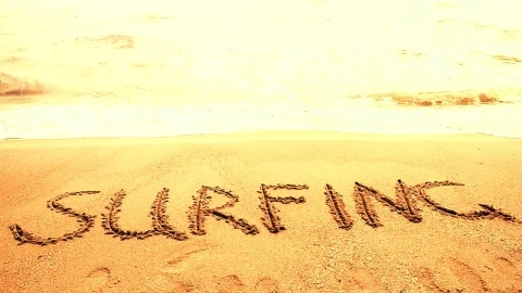 Free Video Stock surfing written in the sand on a sunny beach Live Wallpaper - Free Live Wallpaper