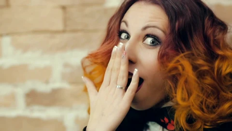 Free Video Stock surprised young woman covers her mouth Live Wallpaper - Free Live Wallpaper