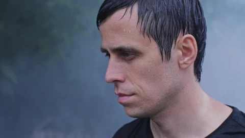 Free Video Stock sweaty man looks at the sky in smoke Live Wallpaper - Free Live Wallpaper