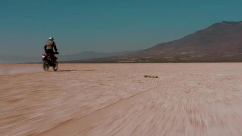 Free Video Stock tacking view of a motorcyclist in the desert Live Wallpaper - Free Live Wallpaper