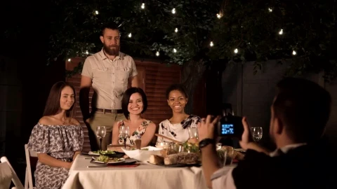 Free Video Stock taking a photo of friends in a reunion Live Wallpaper - Free Live Wallpaper