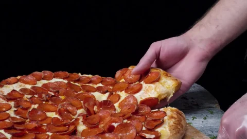 Free Video Stock taking a slice of fresh pizza Live Wallpaper - Free Live Wallpaper
