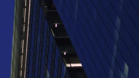 Free Video Stock tall building full of windows at dusk Live Wallpaper - Free Live Wallpaper