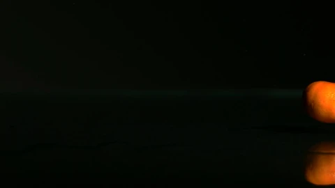 Free Video Stock tangerines rolling on a black surface Live Wallpaper - Free Live Wallpaper