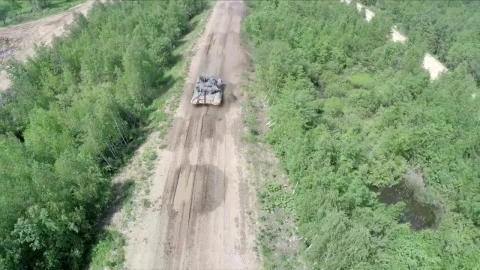 Free Video Stock tank driving over rough terrain Live Wallpaper - Free Live Wallpaper
