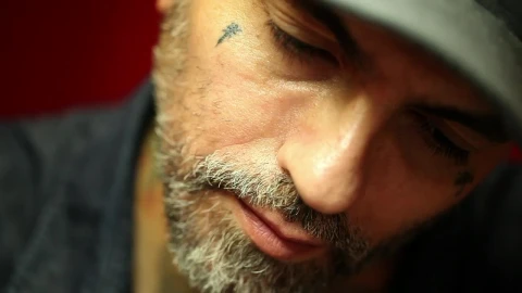 Free Video Stock tattoo artist doing a tattoo to a client Live Wallpaper - Free Live Wallpaper