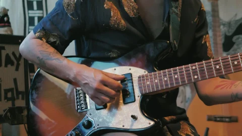 Free Video Stock tattooed man playing an electric guitar Live Wallpaper - Free Live Wallpaper