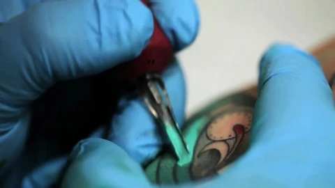 Free Video Stock tattooist tattooing a blue butterfly Live Wallpaper - Free Live Wallpaper