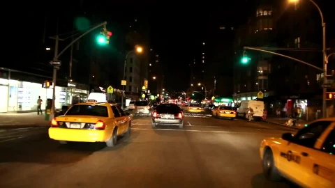 Free Video Stock taxis driving through the streets at night Live Wallpaper - Free Live Wallpaper
