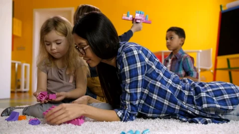 Free Video Stock teacher and students on a carpet playing Live Wallpaper - Free Live Wallpaper