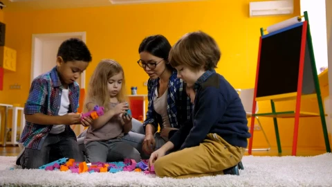 Free Video Stock teacher with little children playing with legos Live Wallpaper - Free Live Wallpaper