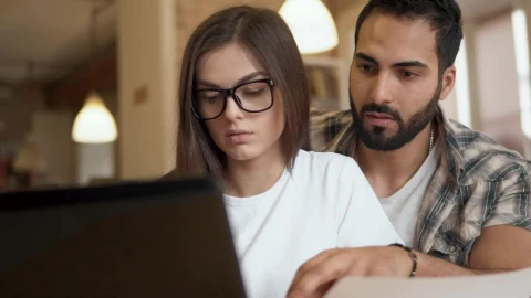 Free Video Stock team leader helps coworker solve problem Live Wallpaper - Free Live Wallpaper