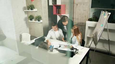 Free Video Stock team leader helps young designers solve problems Live Wallpaper - Free Live Wallpaper