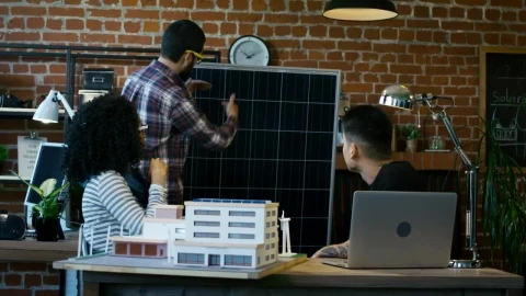 Free Video Stock team of architects reviewing a building model Live Wallpaper - Free Live Wallpaper
