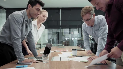 Free Video Stock team standing around a table Live Wallpaper - Free Live Wallpaper