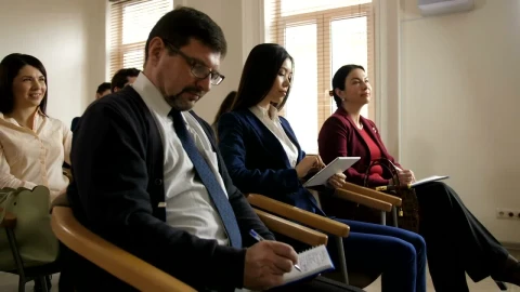 Free Video Stock team writing notes during a speech Live Wallpaper - Free Live Wallpaper