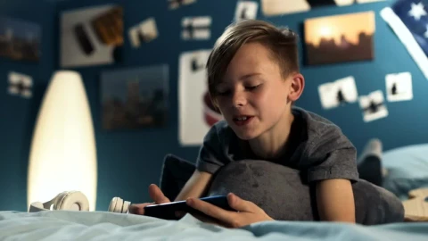 Free Video Stock teen boy chatting on the phone in the bedroom Live Wallpaper - Free Live Wallpaper