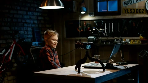 Free Video Stock teen boy doing a video blog in the garage Live Wallpaper - Free Live Wallpaper