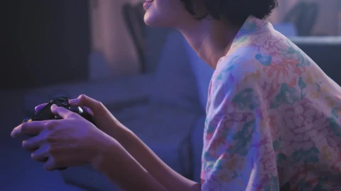 Free Video Stock teen playing video games in the living room Live Wallpaper - Free Live Wallpaper