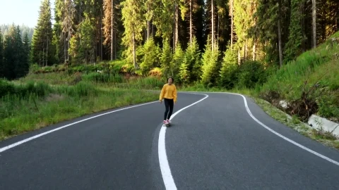 Free Video Stock teen woman on a skateboard on the road Live Wallpaper - Free Live Wallpaper