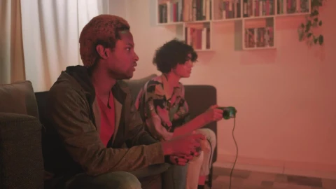 Free Video Stock teenage couple playing video games in the living room Live Wallpaper - Free Live Wallpaper
