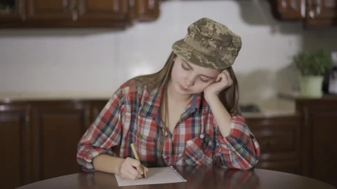 Free Video Stock teenage girl writes letter to army dad Live Wallpaper - Free Live Wallpaper
