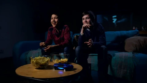 Free Video Stock teens watching a funny film together Live Wallpaper - Free Live Wallpaper