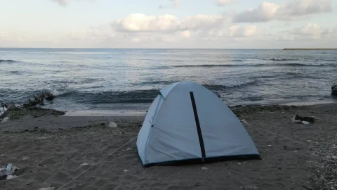 Free Video Stock tent at the edge of the sea on a beach Live Wallpaper - Free Live Wallpaper