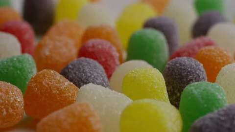 Free Video Stock texture of colored gummies spinning slow Live Wallpaper - Free Live Wallpaper