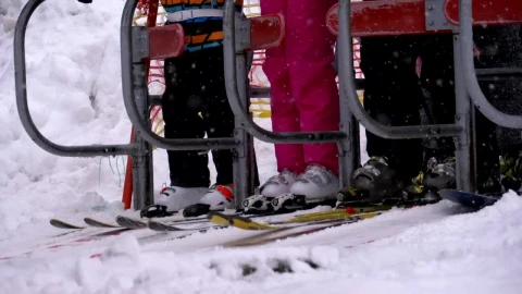 Free Video Stock the skiers getting ready to board the ski lift Live Wallpaper - Free Live Wallpaper