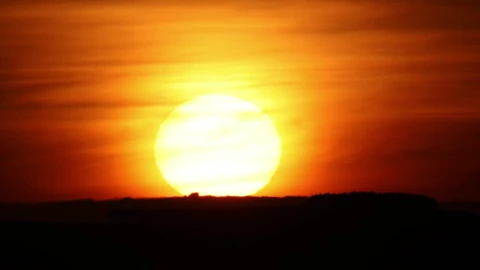Free Video Stock the sun hiding on the horizon during sunset Live Wallpaper - Free Live Wallpaper