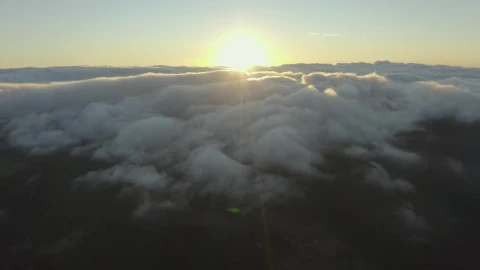 Free Video Stock the sun setting on the horizon of a cloudy mountain Live Wallpaper - Free Live Wallpaper