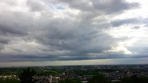 Free Video Stock thick clouds over a large city Live Wallpaper - Free Live Wallpaper