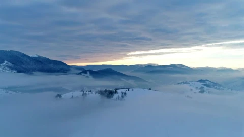 Free Video Stock thick layer of clouds over snowy mountains Live Wallpaper - Free Live Wallpaper