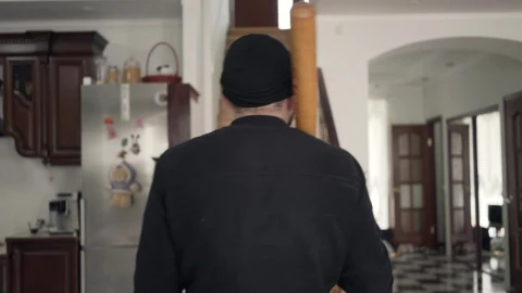Free Video Stock thief with baseball bat looks around house Live Wallpaper - Free Live Wallpaper